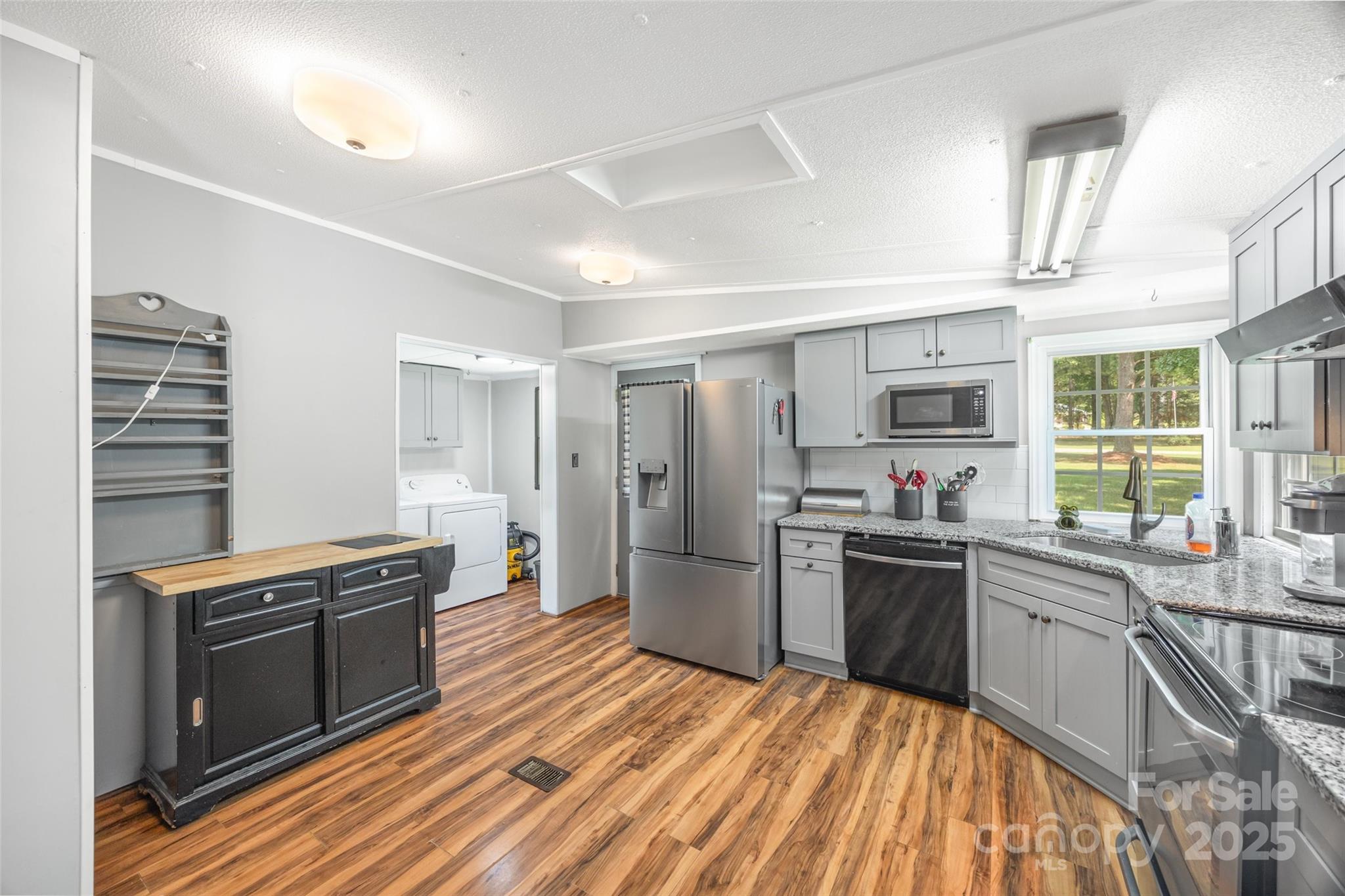 2784 Billy Wilson Road, Unit 15 Rock Hill, SC 29732 - Photo 13 of 33 a kitchen with stainless steel appliances granite countertop a stove top oven a sink dishwasher and a refrigerator