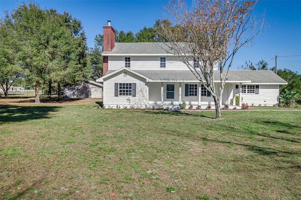 5946 Anderson Road Bartow, FL 33830 - Photo 1 of 1 a front view of a house with a garden