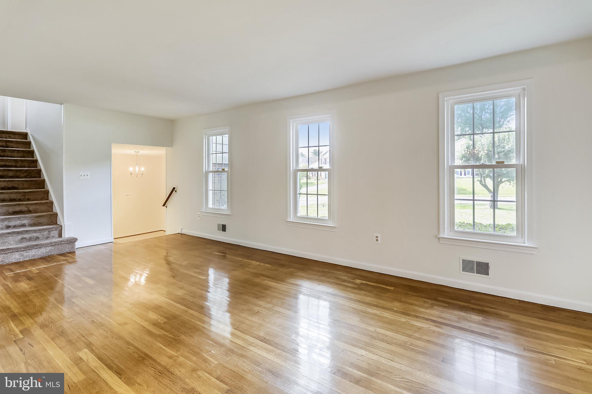 14825 Notley Road Silver Spring, MD 20905 - Photo 6 of 60 Large living room with space for a grand piano