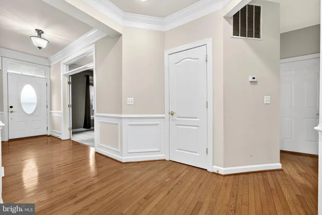 a kitchen with stainless steel appliances granite countertop a stove a refrigerator and a sink