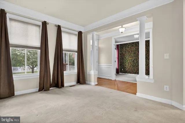 a large kitchen with stainless steel appliances granite countertop a stove a sink and a microwave