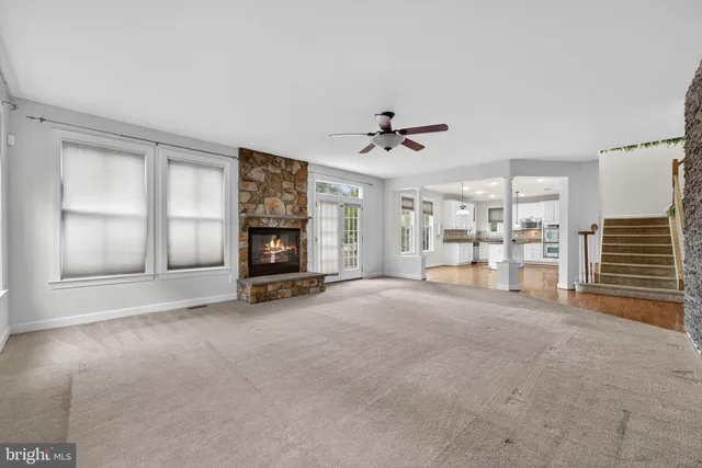 a view of a hallway view with wooden floor and staircase