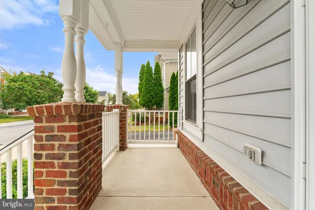 a view of an entryway with wooden floor and windows