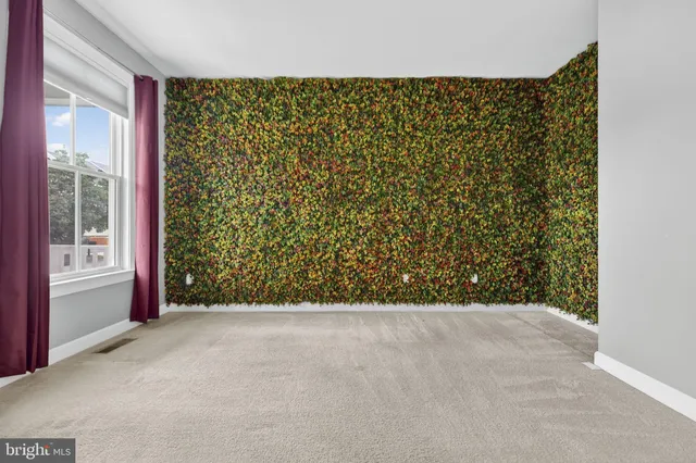 a kitchen with stainless steel appliances granite countertop a refrigerator a sink dishwasher a stove and white cabinets with wooden floor