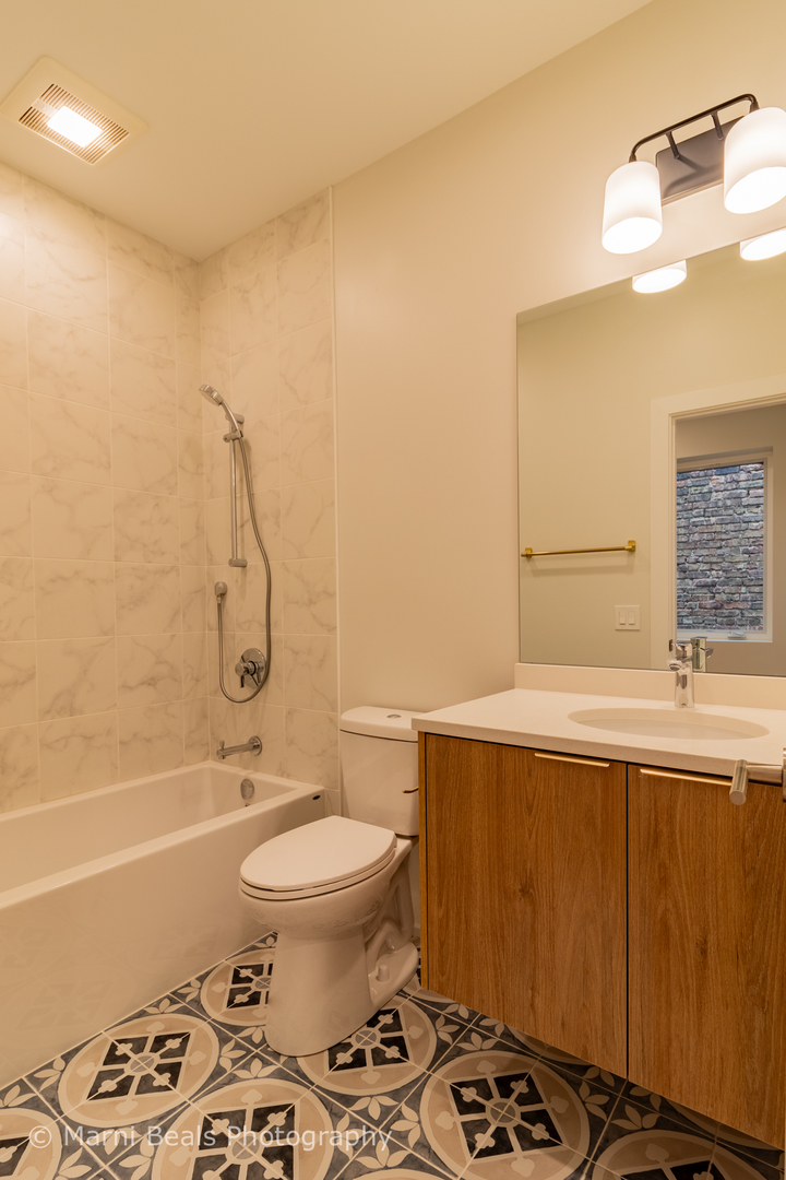 12 West 44th Street Chicago, IL 60632 - Photo 16 of 29 a bathroom with a sink a toilet and a bathtub
