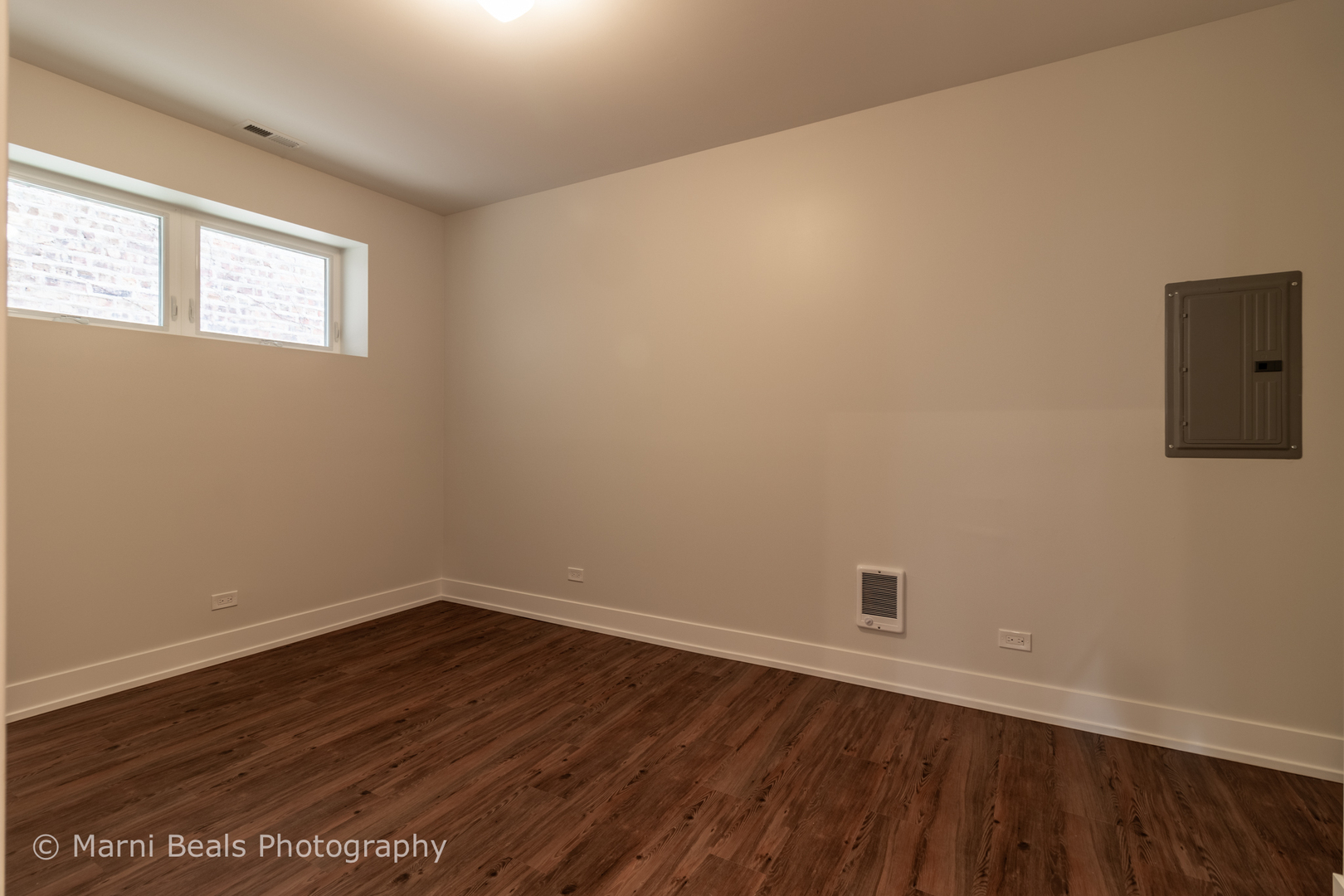 12 West 44th Street Chicago, IL 60632 - Photo 29 of 29 a view of a room with wooden floor and windows