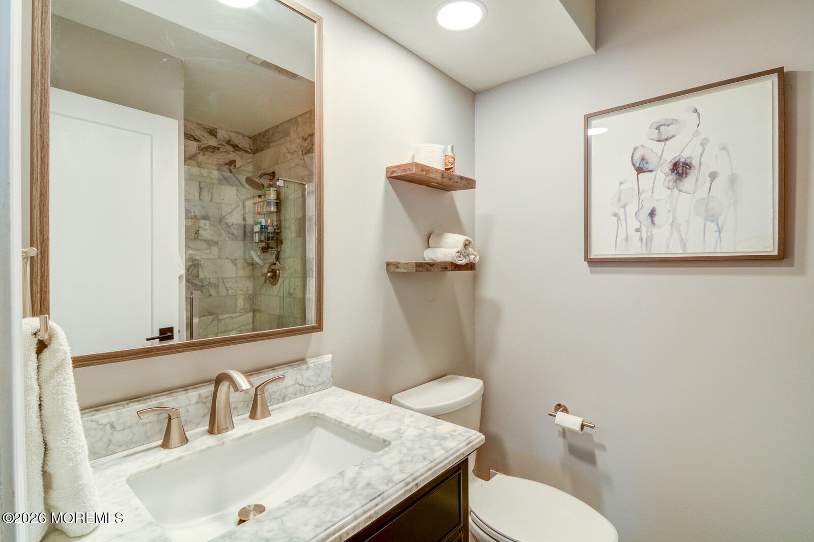 1 White Oak Court Howell, NJ 07731 - Photo 12 of 13 a bathroom with a granite countertop toilet a sink and a mirror