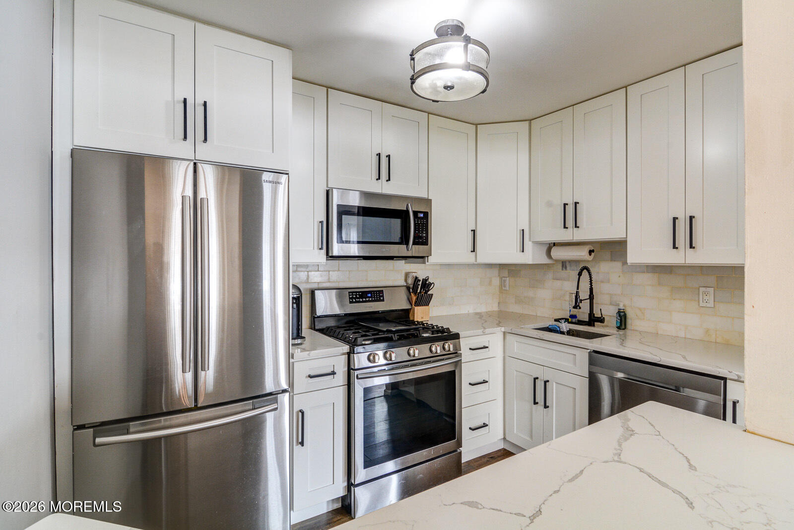 1 White Oak Court Howell, NJ 07731 - Photo 8 of 13 a kitchen with cabinets stainless steel appliances and a counter space