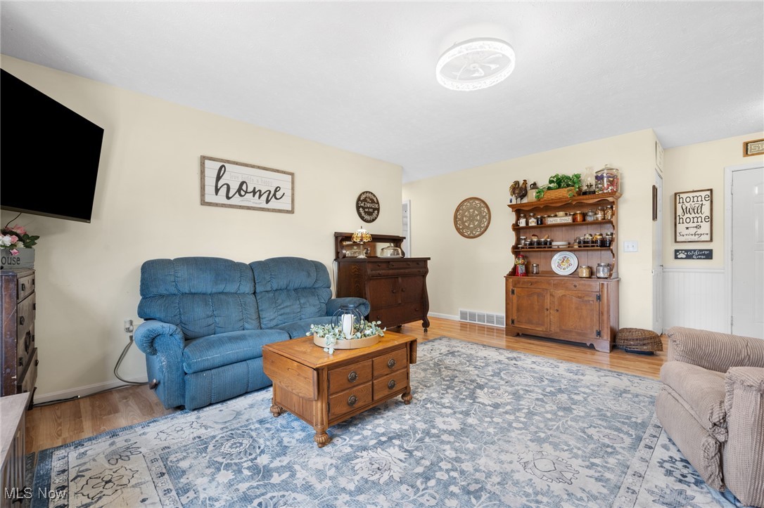 9208 Thorpe Road Berlin Heights, OH 44814 - Photo 15 of 47 Living area featuring wood finished floors and baseboards
