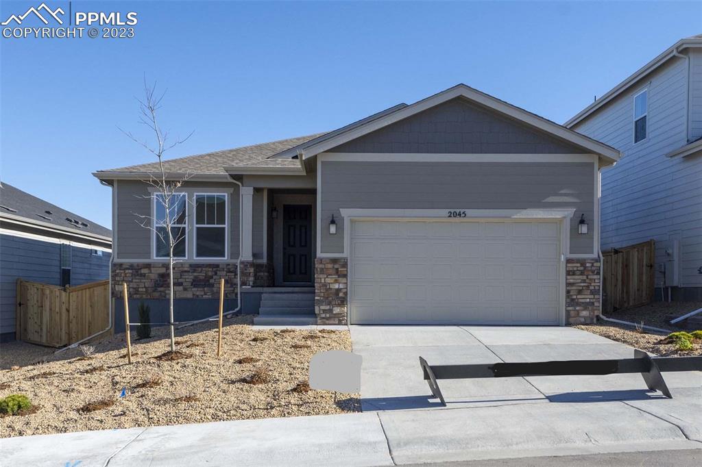 a front view of a house with garage