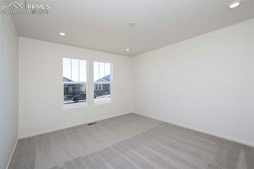 2045 Peachleaf Loop Castle Rock, CO 80108 - Photo 18 of 21 an empty room with a window