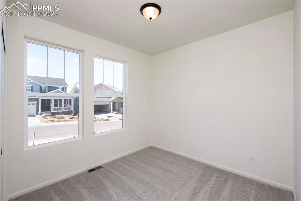 2045 Peachleaf Loop Castle Rock, CO 80108 - Photo 2 of 21 an empty room with windows