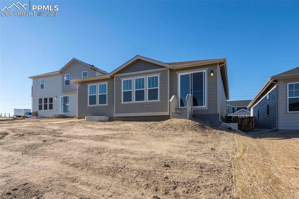 2045 Peachleaf Loop Castle Rock, CO 80108 - Photo 21 of 21 a house with yard in front of it
