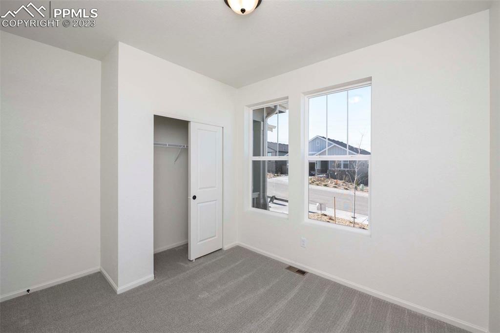 2045 Peachleaf Loop Castle Rock, CO 80108 - Photo 3 of 21 an empty room with windows