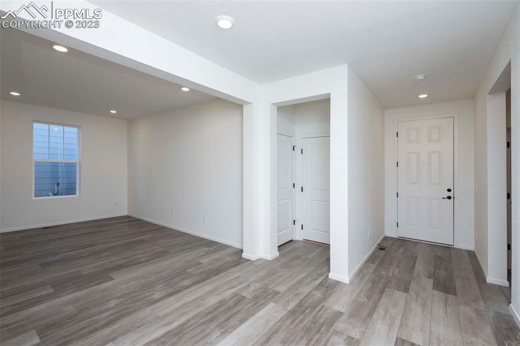 2045 Peachleaf Loop Castle Rock, CO 80108 - Photo 6 of 21 a view of an empty room with wooden floor and closet