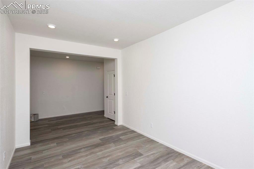 2045 Peachleaf Loop Castle Rock, CO 80108 - Photo 8 of 21 a view of an empty room with wooden floor