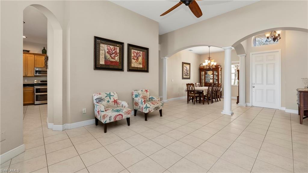 1730 Sarazen Place Naples, FL 34120 - Photo 13 of 50 a living room with furniture