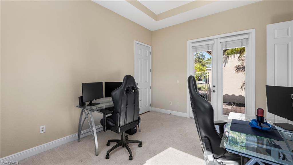 1730 Sarazen Place Naples, FL 34120 - Photo 25 of 50 a view of a workspace with furniture and a window