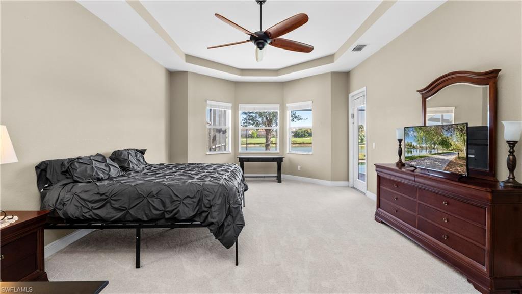 1730 Sarazen Place Naples, FL 34120 - Photo 28 of 50 a living room with a bed furniture and a window