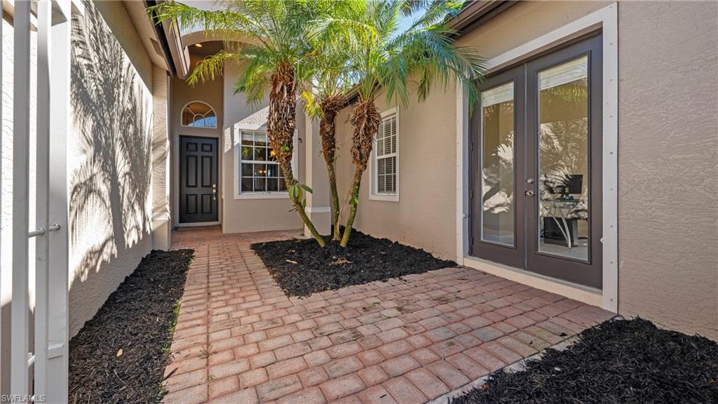 1730 Sarazen Place Naples, FL 34120 - Photo 35 of 50 a front view of a house