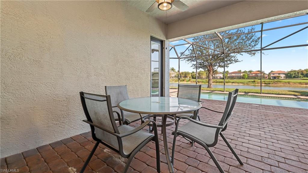 1730 Sarazen Place Naples, FL 34120 - Photo 36 of 50 a dining room with furniture and a floor to ceiling window
