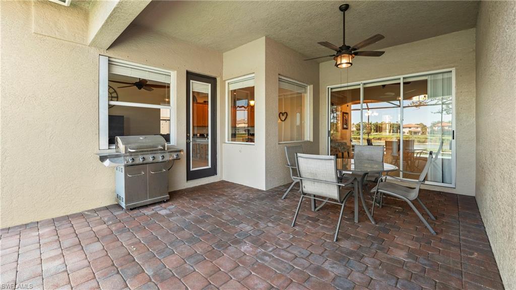 1730 Sarazen Place Naples, FL 34120 - Photo 37 of 50 a dining room with furniture and window