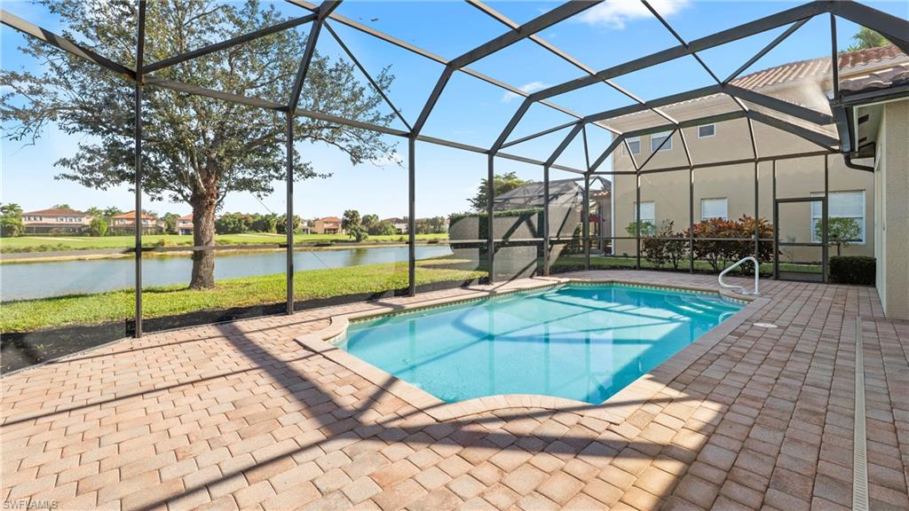1730 Sarazen Place Naples, FL 34120 - Photo 38 of 50 a view of a backyard with swimming pool