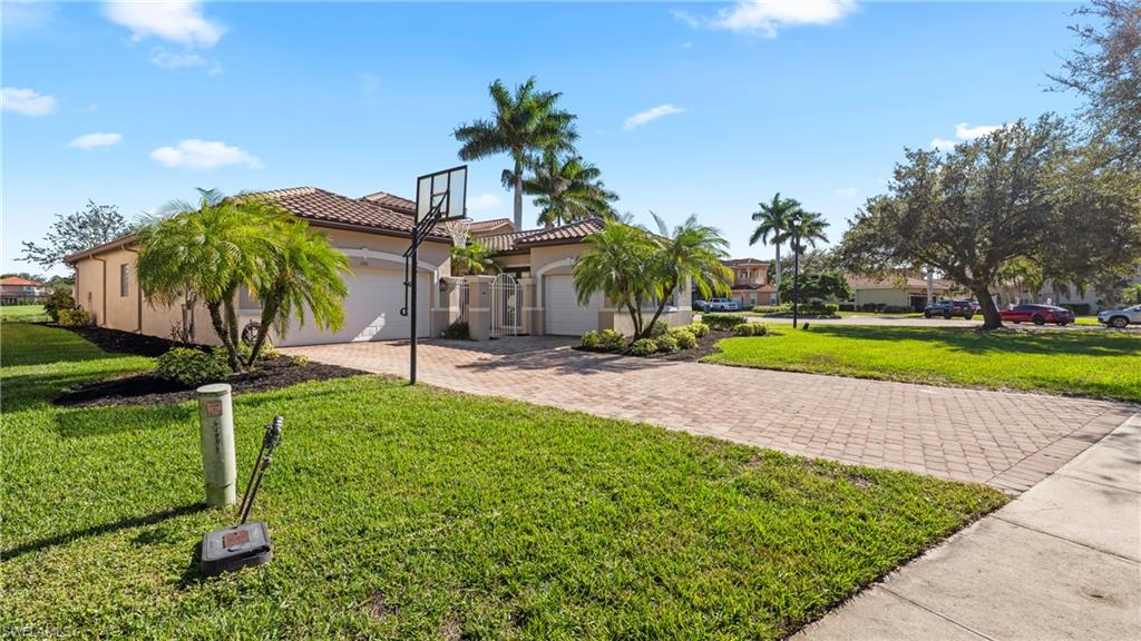 1730 Sarazen Place Naples, FL 34120 - Photo 41 of 50 a view of a yard with palm trees