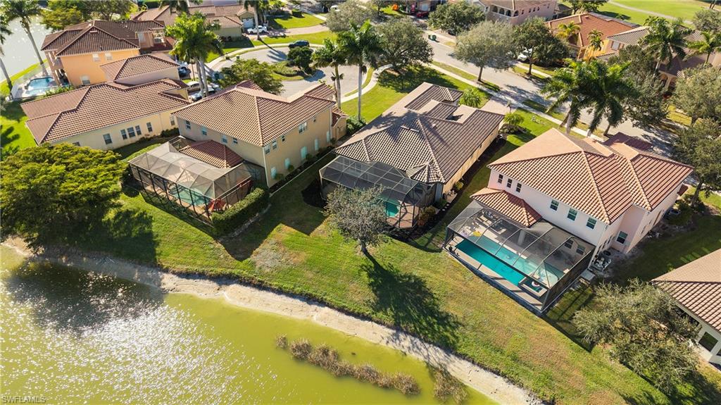 1730 Sarazen Place Naples, FL 34120 - Photo 43 of 50 an aerial view of a house with a garden and swimming pool