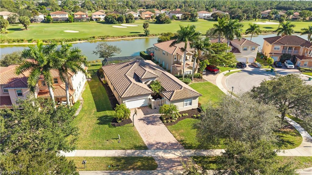 1730 Sarazen Place Naples, FL 34120 - Photo 47 of 50 a view of a swimming pool and outdoor space