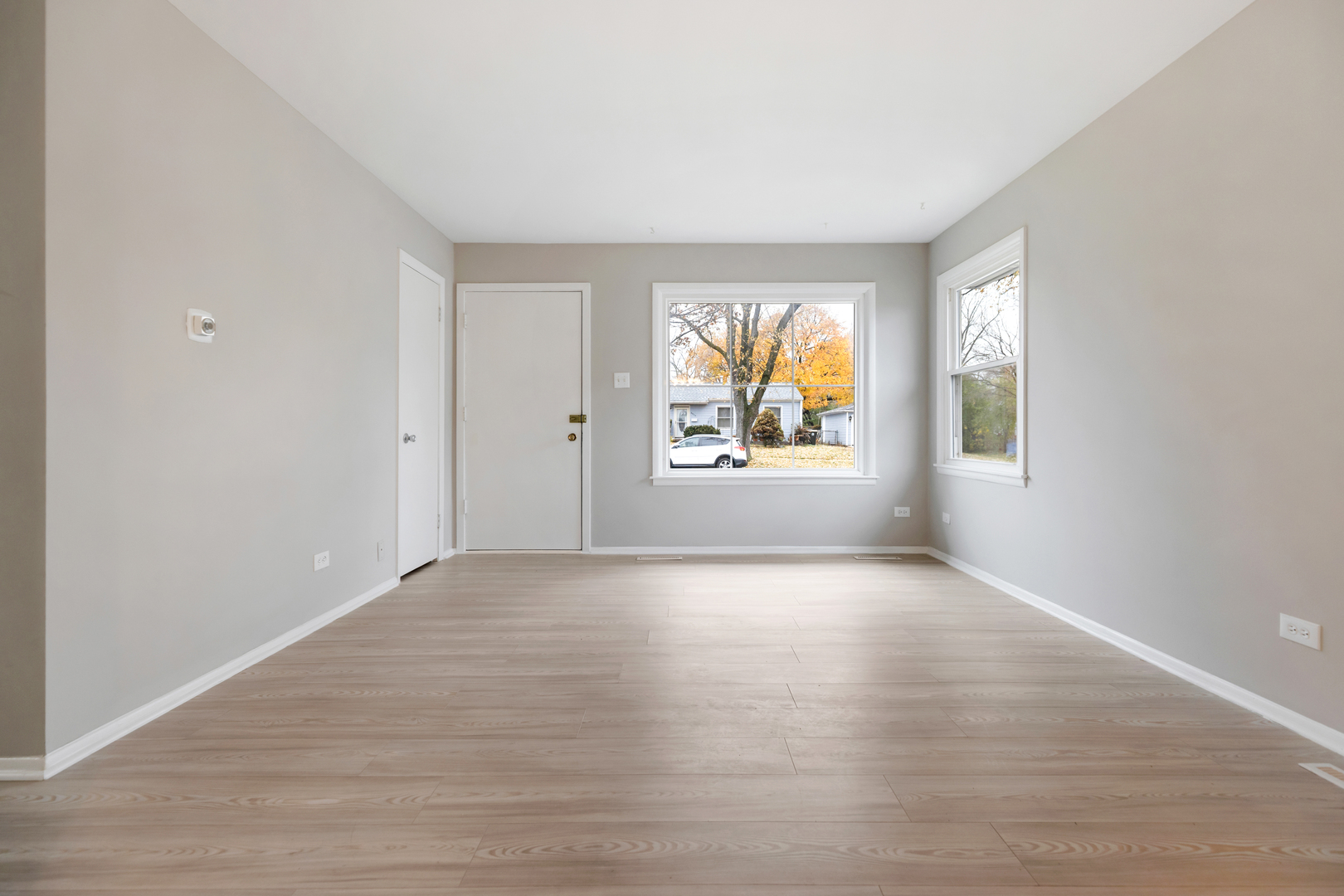 6971 Hanover Street Hanover Park, IL 60133 - Photo 4 of 20 a view of empty room with window and wooden floor