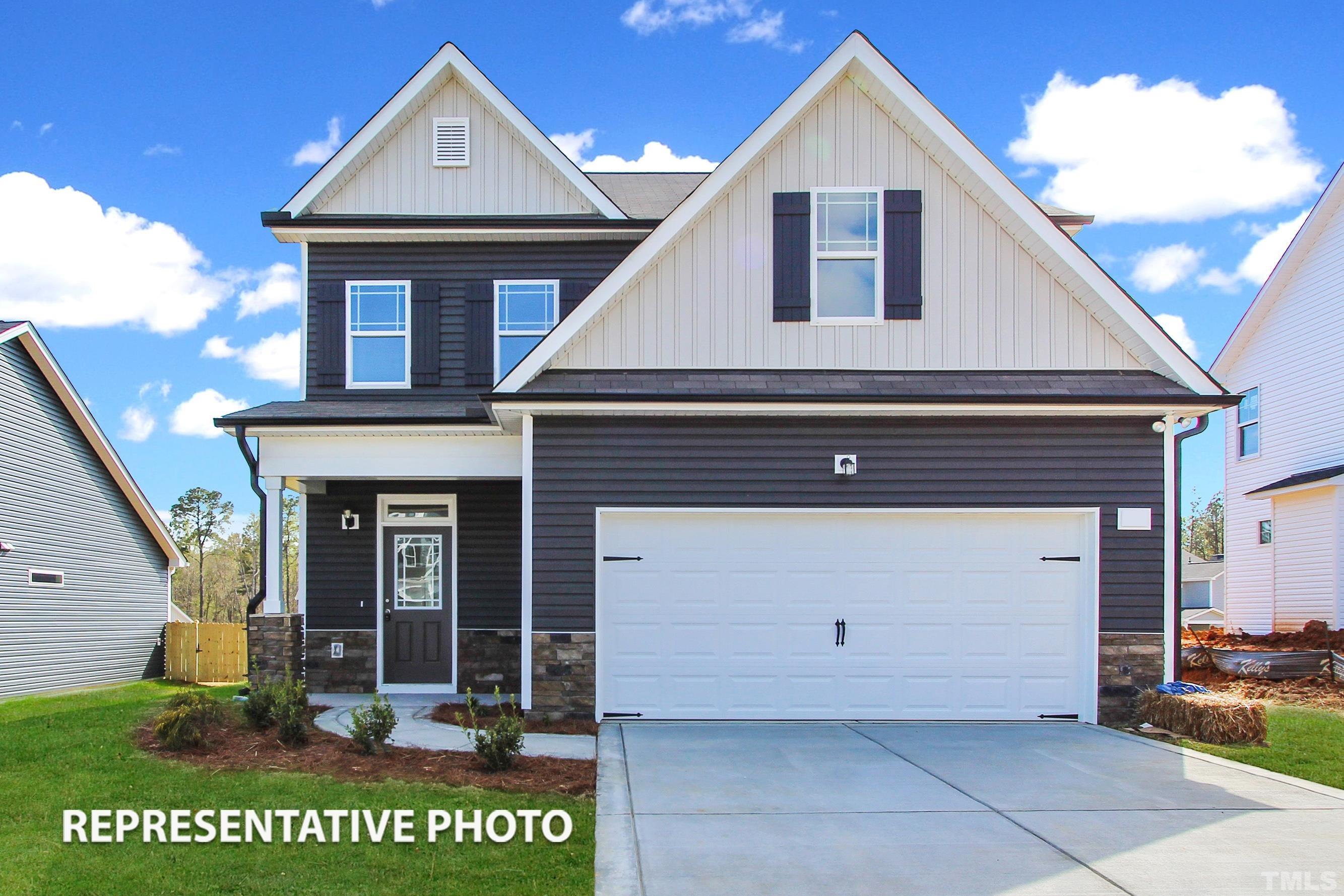 a front view of a house with a garage