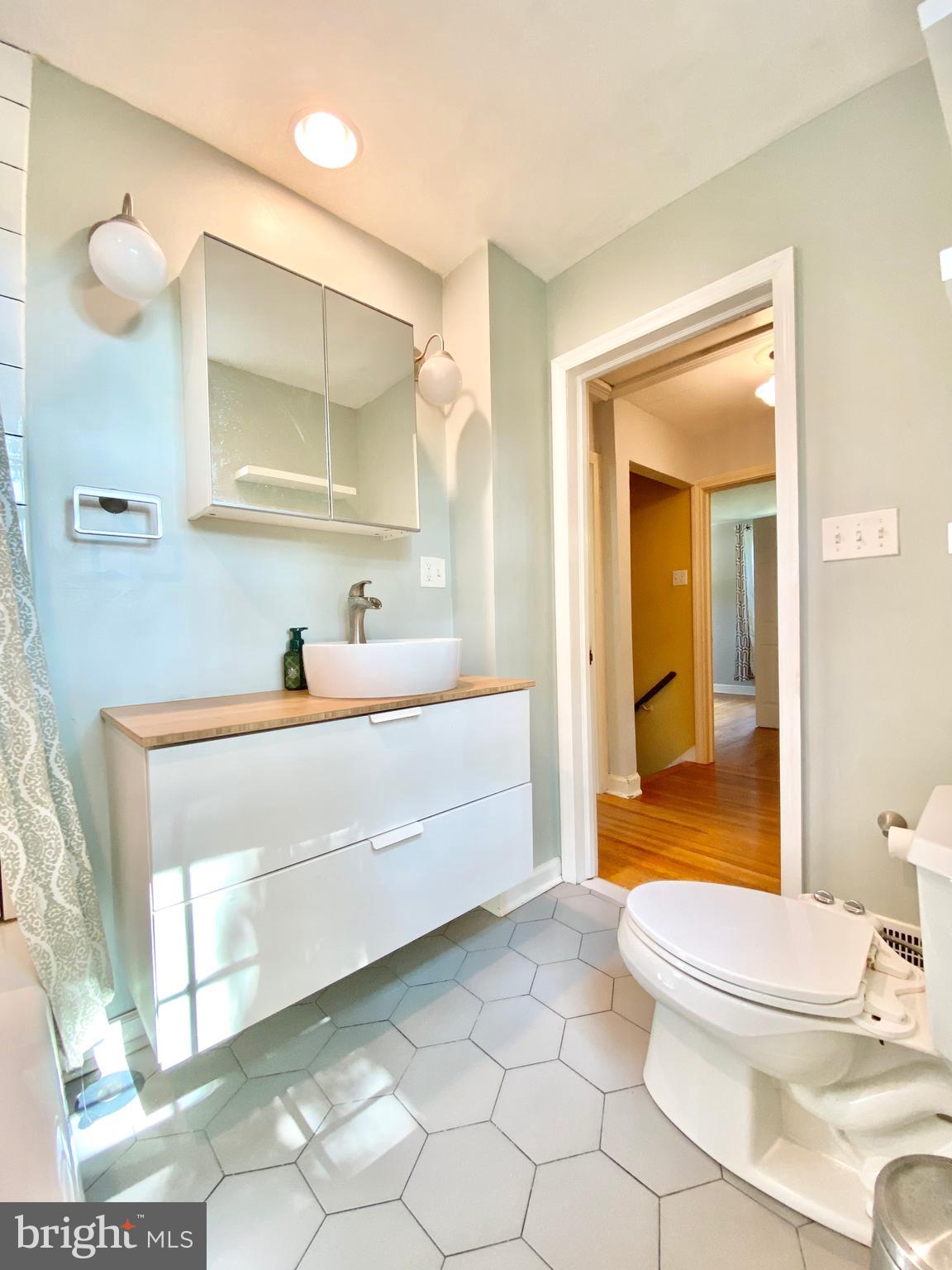 26 Hurst Road Wilmington, DE 19803 - Photo 17 of 74 a bathroom with a sink a toilet and shower