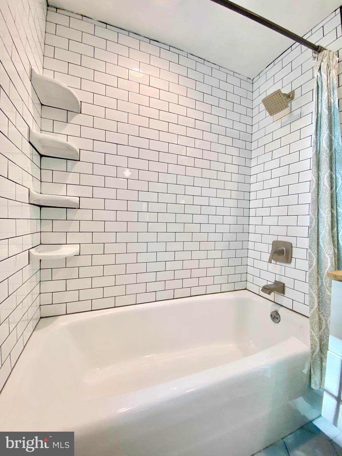 26 Hurst Road Wilmington, DE 19803 - Photo 18 of 74 a bathroom with a bathtub and shower