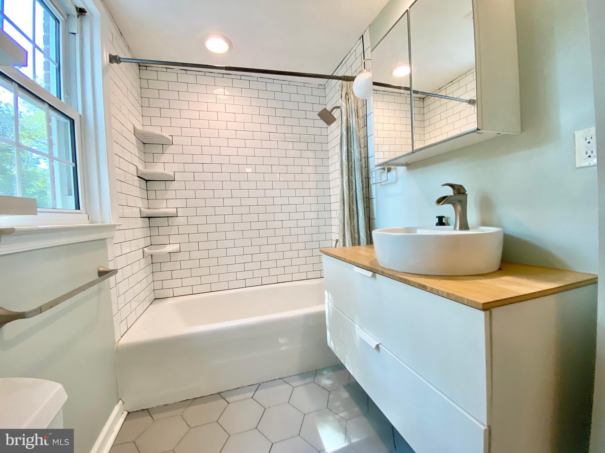 26 Hurst Road Wilmington, DE 19803 - Photo 19 of 74 a bathroom with a bathtub and a sink