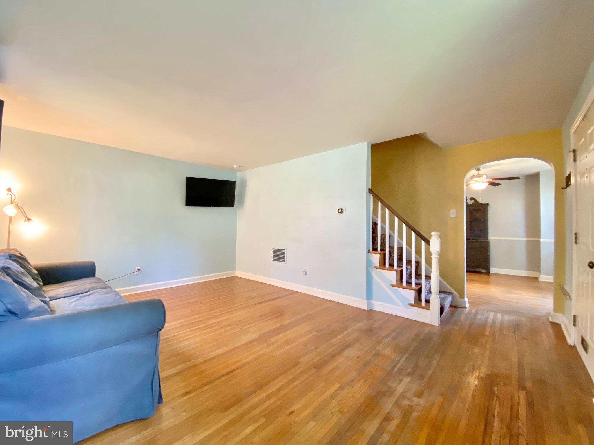 26 Hurst Road Wilmington, DE 19803 - Photo 26 of 74 a view of a livingroom with wooden floor and a ceiling fan