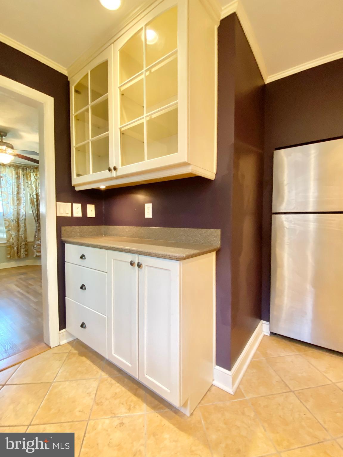 26 Hurst Road Wilmington, DE 19803 - Photo 52 of 74 a view of a kitchen with a sink and a refrigerator