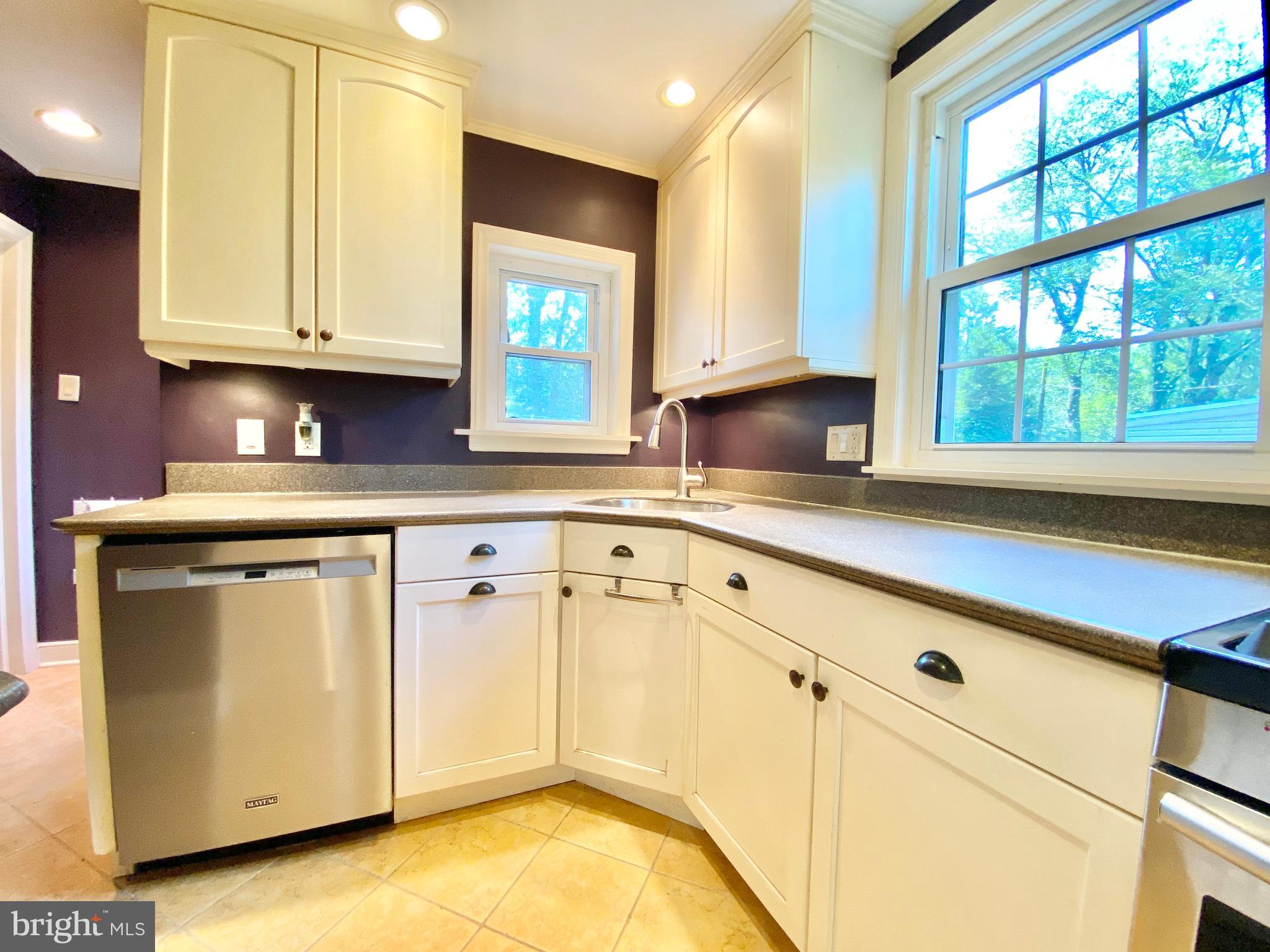26 Hurst Road Wilmington, DE 19803 - Photo 55 of 74 a kitchen with granite countertop white cabinets and a window