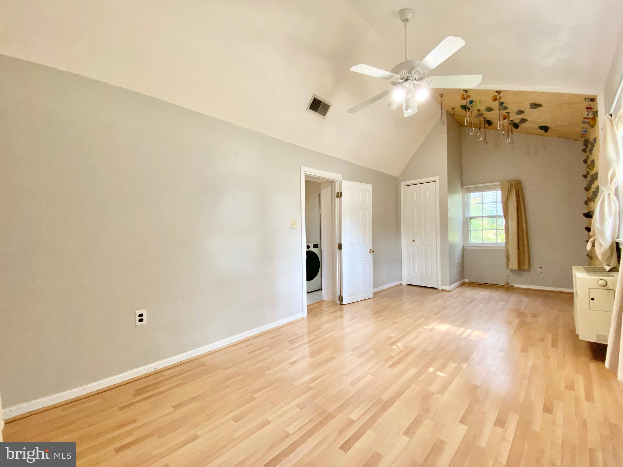 26 Hurst Road Wilmington, DE 19803 - Photo 59 of 74 a view of a livingroom with a chandelier fan and wooden floor