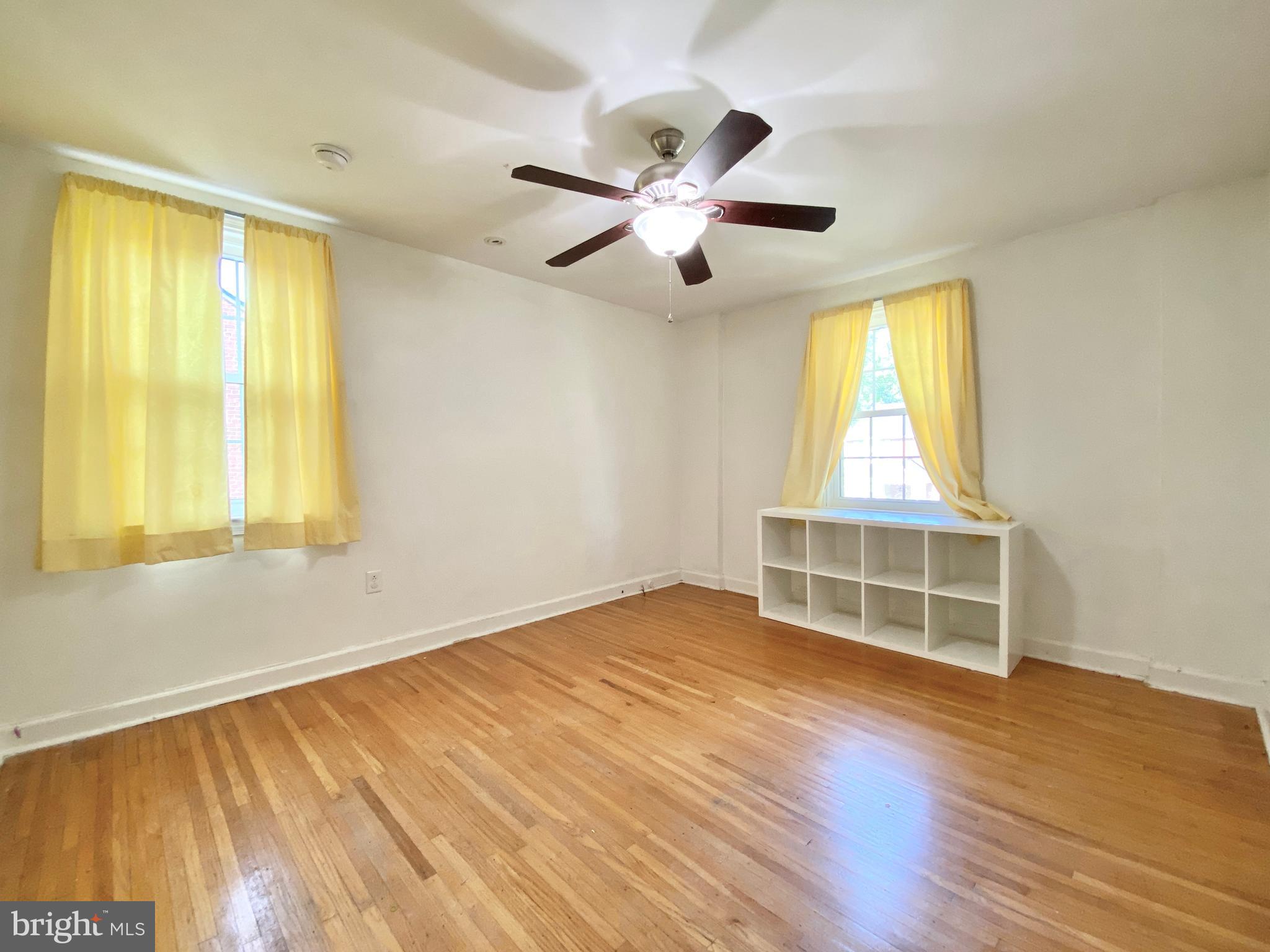 26 Hurst Road Wilmington, DE 19803 - Photo 62 of 74 a view of an empty room with wooden floor and a window