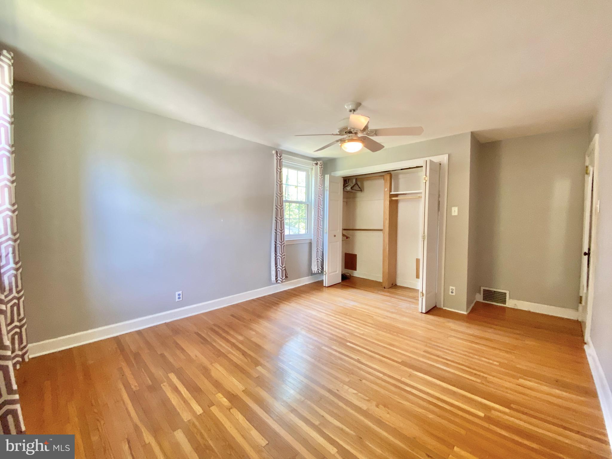 26 Hurst Road Wilmington, DE 19803 - Photo 65 of 74 a view of an empty room with wooden floor and a window