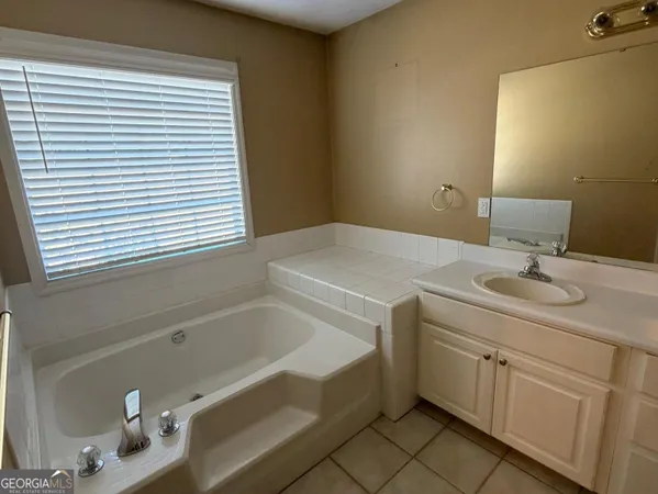 a bathroom with a sink and a bathtub