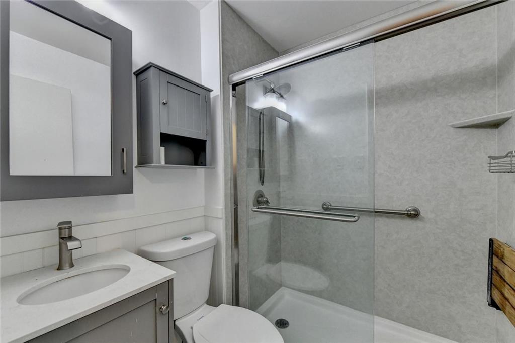 1577 Harbour Oaks Road Tucker, GA 30084 - Photo 37 of 58 a bathroom with a sink toilet and shower