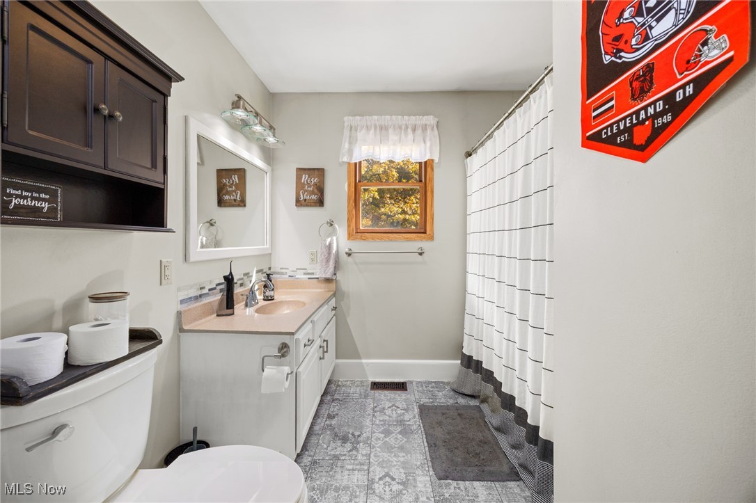 11827 Stratton Road West Salem, OH 44287 - Photo 40 of 47 Full bathroom featuring vanity and a shower with curtain