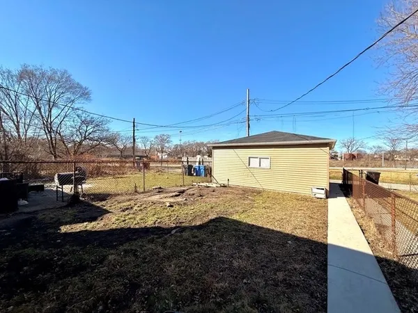 a view of a backyard of the house