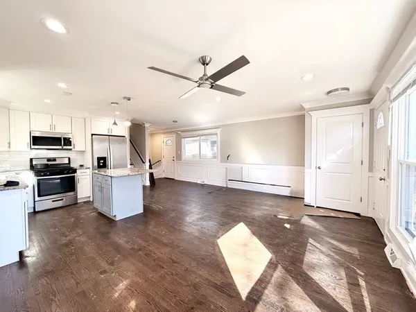 a view of kitchen with sink microwave and refrigerator