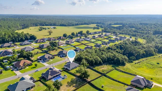 an aerial view of a pool patio swimming pool and outdoor seating