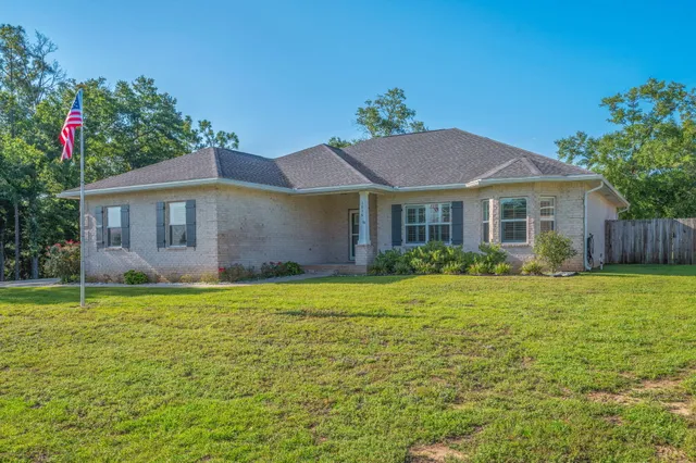 a house with garden in front of it
