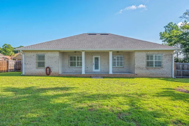 a view of yard with swimming pool and trees
