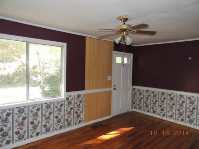 2646 Powersville Road Byron, GA 31008 - Photo 3 of 8 a view of wooden floor and chandelier fan in a room
